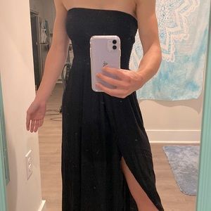 Small black strapless flowy dress with leg split